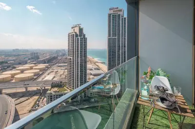 an apartment balcony with a view of a city at Frank Porter - Address JBR in Dubai