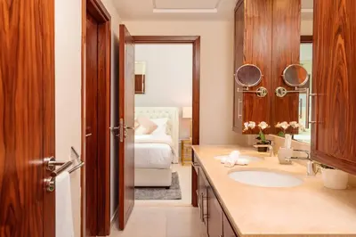 a bathroom with a sink and a bed in a room at Elite Royal Apartment - Full Burj Khalifa & Fountain View - Largest Layout - Half Floor - Luxurious - Archon in Dubai