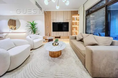 a living room with couches and a coffee table at Zaafaran 1 by Emaar, Downtown Dubai in Dubai