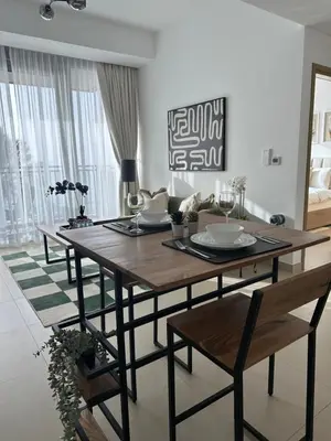 a dining room table and chairs in a living room at Sea View Luxury 5242 Marina JBR Beach 5mins in Dubai