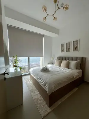 a bedroom with a large bed and a window at Sea View Luxury 5242 Marina JBR Beach 5mins in Dubai