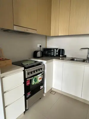 a small kitchen with a stove and a sink at Sea View Luxury 5242 Marina JBR Beach 5mins in Dubai