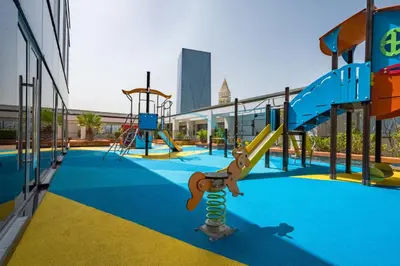 an empty playground with a slide at Modern 2BR in Sky Gardens, DIFC by Deluxe Holiday Homes in Dubai