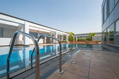 an image of a swimming pool in a building at Modern 2BR in Sky Gardens, DIFC by Deluxe Holiday Homes in Dubai