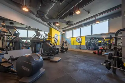 a gym with treadmills and machines in a room at Modern 2BR in Sky Gardens, DIFC by Deluxe Holiday Homes in Dubai