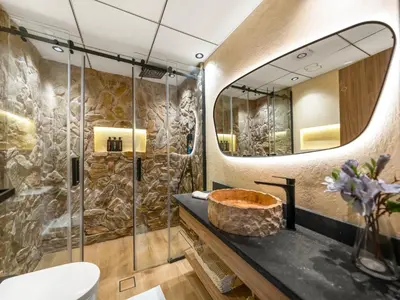 a bathroom with a large mirror and a sink at Luxury Penthouse In The Heart of Dubai Marina in Dubai