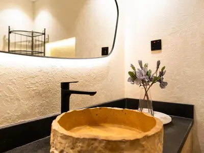 a bathroom with a wooden sink with a mirror at Luxury Penthouse In The Heart of Dubai Marina in Dubai