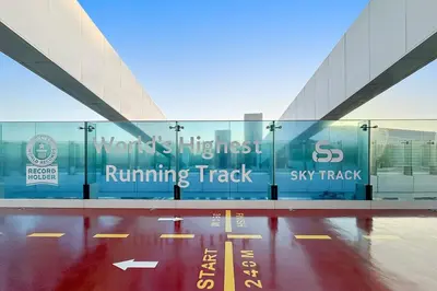 a building with a running track sign on it at FIRST CLASS 2BR Panoramic Views of Dubai Frame in Dubai