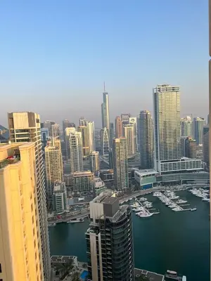 a view of a city with boats in the water at Luxurious JBR Beach Facing 4BHK in Dubai