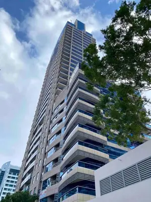 a tall building with a tree in front of it at Stylist Studio in Marina near beach and Metro Z1103 in Dubai