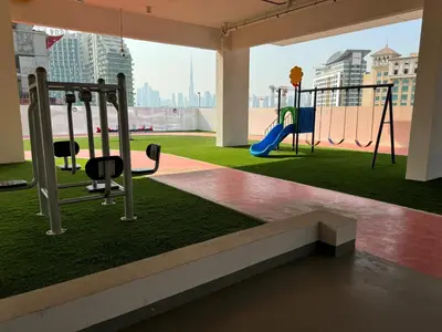 a playground in a building with a playground at Spacious Studio with Burj Khalifa Views in Dubai