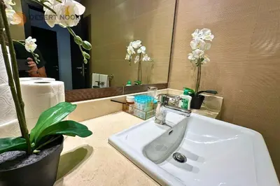 a white sink in a bathroom with a mirror at Best Location Marina & Sea View 1 min from JBR in Dubai