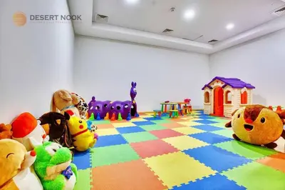 a room with stuffed animals sitting on a colorful floor at Best Location Marina & Sea View 1 min from JBR in Dubai