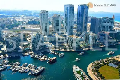 an aerial view of a city with boats in the water at Best Location Marina & Sea View 1 min from JBR in Dubai