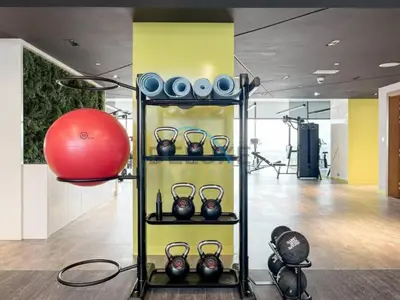 a shelf with vases and a red ball in a gym at Limited Time Offer Tranquil 1BR in Business Bay by Deluxe Holiday Homes in Dubai