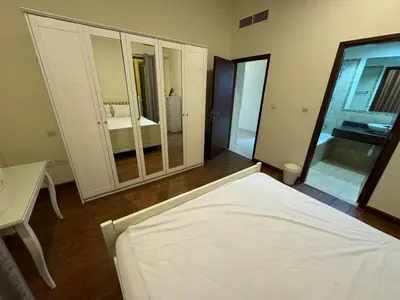 a bedroom with a bed and a large mirror at Master room in Jumeira Beach Residence - JBR in Dubai