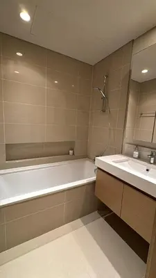 a bathroom with a bath tub and a sink at 1bedroom Apartment With Stunning view Creek Harbour in Dubai