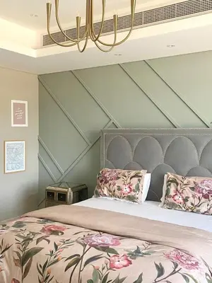 a bedroom with a large bed with a chandelier at Luxurious Meydan Dubai 6 BED Villa Unparalleled Views in Dubai