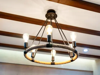a chandelier hanging from a ceiling at Luxury 2BR Apartment with Full Marina Views in Dubai