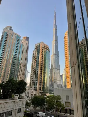 a view of a city with tall buildings at Burj KhalifaView Luxury 1-Bedroom Apartment in Dubai