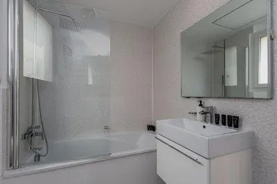 a white bathroom with a tub and a sink at Family Friendly - 2BR & Maid's Room in The Springs 10 - Allsopp & Allsopp in Dubai