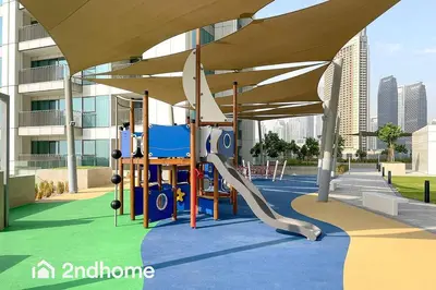 a playground in a building with a slide at Downtown Views 1 A Direct Access to Dubai Mall in Dubai