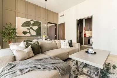 a living room with a couch and a table at Downtown Views 1 A Direct Access to Dubai Mall in Dubai