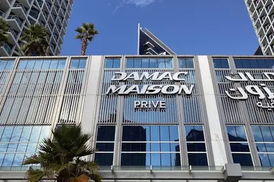 a building with a sign on the side of it at Vserve Stylish Suite 1 BR with Burj Khalifa and Canal view in Dubai