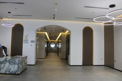 a hallway of a building with two doors and a hallwayngth at One bed apartment at a great location in Dubai Marina in Dubai