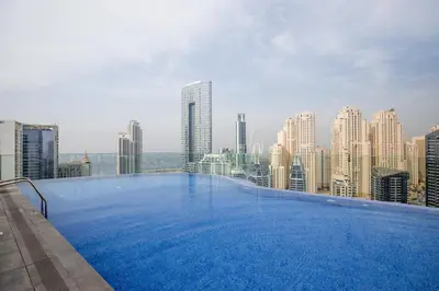 a large swimming pool on the roof of a building at Stunning 1BR in heart of Dubai Marina in Dubai