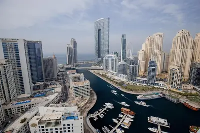 a view of a city with a river and buildings at Stunning 1BR in heart of Dubai Marina in Dubai