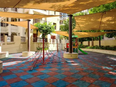 a playground with a tent and a swing at Maison Privee - Stylish & Spacious Apartment in Downtown Dubai in Dubai