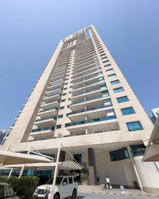 a tall building with a car parked in front of it at GuestReady - Serene Dubai Marina haven in Dubai