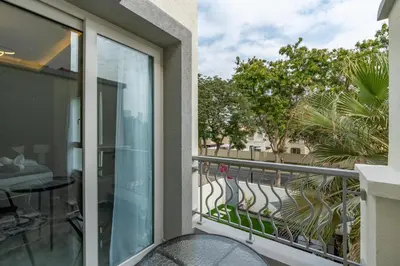 a balcony with a view of a street at White Sage Brand New 3BR Villa with Garden and Two Balconies in Dubai