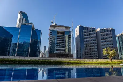 a view of a city skyline with tall buildings at Cozy 1BR Apartment with Water View Business Bay in Dubai