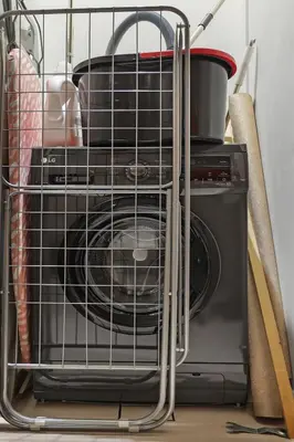 a dish washer in a wire basket on top of a microwave at FIRST CLASS 1BR Stylish & Luxurious in Dubai