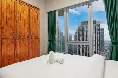 a bedroom with a bed and a large window at FIRST CLASS 1BR Stylish & Luxurious in Dubai