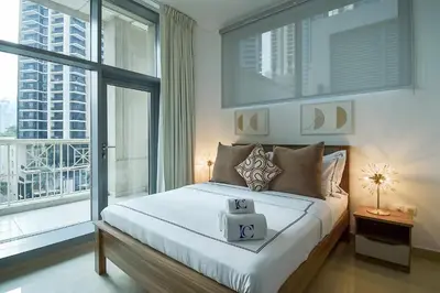 a bedroom with a bed and a large window at Luxury Escapes - Modern 3BR Apt Stylish, Spacious and Comfortable in Dubai