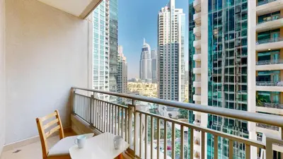 a balcony with a table and a view of a city at BLVD Central 2 - Studio Apartment in Downtown in Dubai