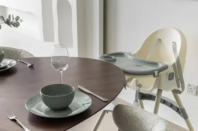 a wooden table with a cup and a wine glass at Kinfolk Homes - No 1 Family Stay, Partial Burj Khalifa Fountain View in Dubai