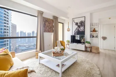 a living room with a view of a city at Frank Porter - Bahar 6 in Dubai