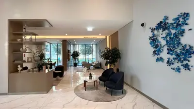 a living room with a heart on the wall at High-Floor Luxe 2BR Stunning Burj Khalifa & Fountain Views Direct Dubai Mall Access in Dubai