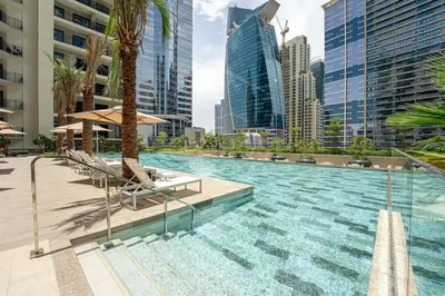 a swimming pool in a city with tall buildings at New Listing - Sauna - Gym Pool - Business Bay in Dubai