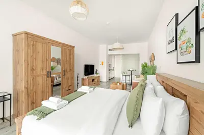 a bedroom with a large white bed with white pillows at Silkhaus Beach Access Studio in Palm Views East in Dubai