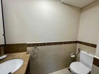 a bathroom with a toilet and a sink at Silkhaus 1BR Downtown Heart in Emaar Tower in Dubai