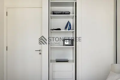 a room with a door with a sign on it at Bright 1BR at Collective Tower 1 Near Hills Mall in Dubai