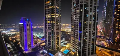 a view of a city at night with tall buildings at Dubai Marina, 2 Bedrooms, apartment, sea view, JBR in Dubai