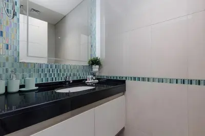 a bathroom with a sink and a mirror at Sea View, Easy Access, Close to All Amenities in Dubai