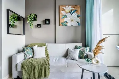 a living room with a couch and a table at Stylish 1BR in the heart of Dubai - easy walk by the canal in Dubai