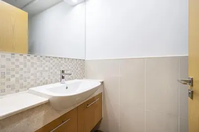 a bathroom with a sink and a mirror at Full Burj Khalifa View, TOP Floor, 5min Dubai Mall in Dubai